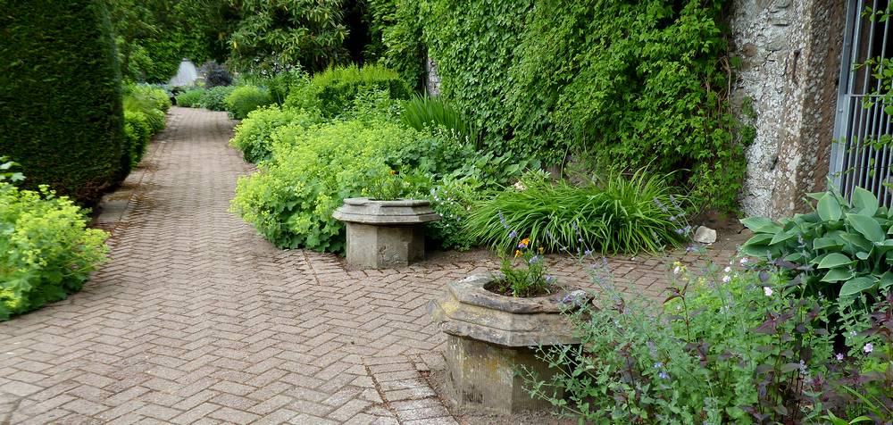 The chimneys of Stockbriggs House here used as flower containers in the walled garden